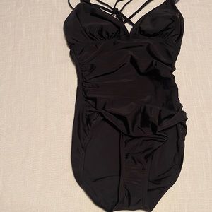 NEW. Size small one piece